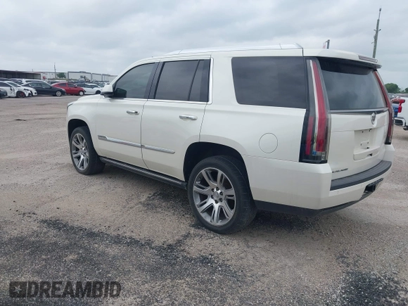 2015 Cadillac Escalade Premium z VIN 1GYS4CKJ4FR216873, wystawiony jako IAAI lot #41677234 z przebiegiem 128 990 mil mil oraz . Historia ofert i sprzedaży dostępna na DreamBid. Obrazek 3.