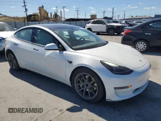 2022 Tesla Model 3 with VIN 5YJ3E1EAXNF203914, listed as a Copart auction lot 46982935 with 70,766 mi miles and Salvage Title. Bid and sale history available at DreamBid. Image 4.