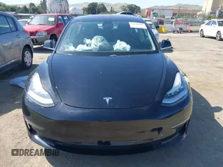 2018 Tesla Model 3 Long Range Battery with VIN 5YJ3E1EA7JF057031, listed as a IAAI auction lot 42139832 with 92,618 mi miles and . Bid and sale history available at DreamBid. Image 11.