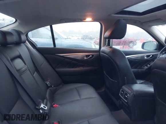 2015 Infiniti Q50 Premium z VIN JN1BV7ARXFM412382, wystawiony jako IAAI lot #40776813 z przebiegiem 66 406 mil mil oraz . Historia ofert i sprzedaży dostępna na DreamBid. Obrazek 8.