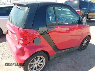 2009 Smart fortwo Pure z VIN WMEEJ31X59K291372, wystawiony jako IAAI lot #41826469 z przebiegiem 87 773 mil mil oraz . Historia ofert i sprzedaży dostępna na DreamBid. Obrazek 4.