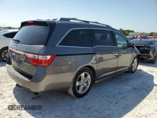 2011 Honda Odyssey Touring with VIN 5FNRL5H97BB501213, listed as a Copart auction lot 57314115 with 283,538 mi miles and Salvage title. Bid and sale history available at DreamBid. Image 3.