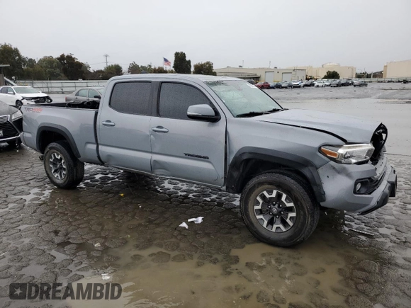 2021 Toyota Tacoma 4WD SR5 with VIN 3TMDZ5BN5MM098717, listed as a Copart auction lot 43877975 with 21,328 mi miles and Salvage Title. Bid and sale history available at carsss.com. Image 4.