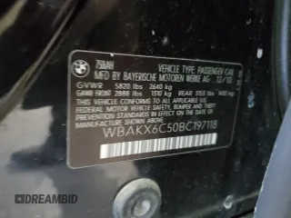 2011 BMW 7 Series with VIN WBAKX6C50BC197118, listed as a Copart auction lot 73686234 with 166,393 mi miles and Clean title. Bid and sale history available at DreamBid. Image 12.