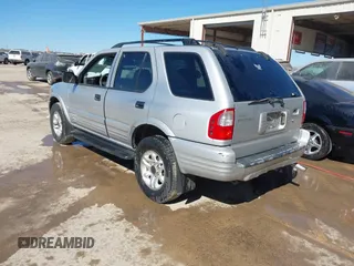 2002 Isuzu Rodeo S with VIN 4S2CK58WX24321556, listed as a IAAI auction lot 41405981 with 172,590 mi miles and . Bid and sale history available at DreamBid. Image 3.