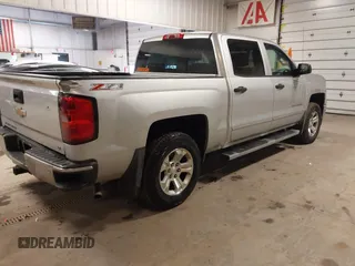 2014 Chevrolet Silverado 1500 LT with VIN 3GCUKREC4EG291351, listed as a IAAI auction lot 41732290 with 194,135 mi miles and . Bid and sale history available at DreamBid. Image 4.
