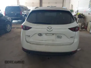 2019 Mazda CX-5 Grand Touring with VIN JM3KFBDM5K0520852, listed as a IAAI auction lot 42686818 with 36,800 mi miles and . Bid and sale history available at DreamBid. Image 16.