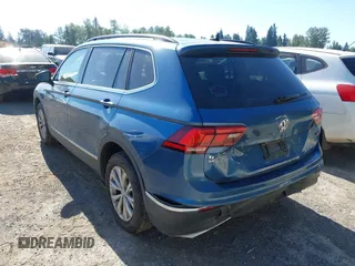 2018 Volkswagen Tiguan SEL z VIN 3VV2B7AX0JM084232, wystawiony jako IAAI lot #42726306 z przebiegiem 97 624 mil mil oraz . Historia ofert i sprzedaży dostępna na DreamBid. Obrazek 3.