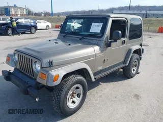 2006 Jeep Wrangler Sport Right Hand Drive with VIN 1J4F449S46P716520, listed as a IAAI auction lot 41763887 with 236,816 mi miles. Bid and sale history available at carsss.com. Image 17.