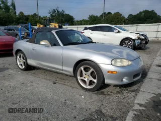 2003 Mazda MX-5 Miata Cloth z VIN JM1NB353630305964, wystawiony jako Copart lot #58517505 z przebiegiem 129 675 mil mil oraz Szkoda całkowita • Salvage title. Historia ofert i sprzedaży dostępna na DreamBid. Obrazek 4.