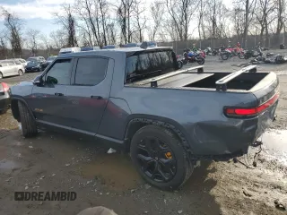 2022 Rivian R1T Adventure Package with VIN 7FCTGAAAXNN005667, listed as a Copart auction lot 44321435 with 48,249 mi miles and Salvage Title. Bid and sale history available at carsss.com. Image 2.