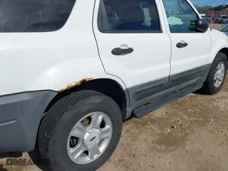 2003 Ford Escape XLT Popular 2 with VIN 1FMCU93163KB78008, listed as a IAAI auction lot 41660779 with 153,898 mi miles. Bid and sale history available at carsss.com. Image 13.