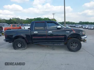 2003 Ford F-150 XLT z VIN 1FTRW08L73KA58913, wystawiony jako IAAI lot #41907277 z przebiegiem 147 294 mil mil oraz . Historia ofert i sprzedaży dostępna na DreamBid. Obrazek 13.
