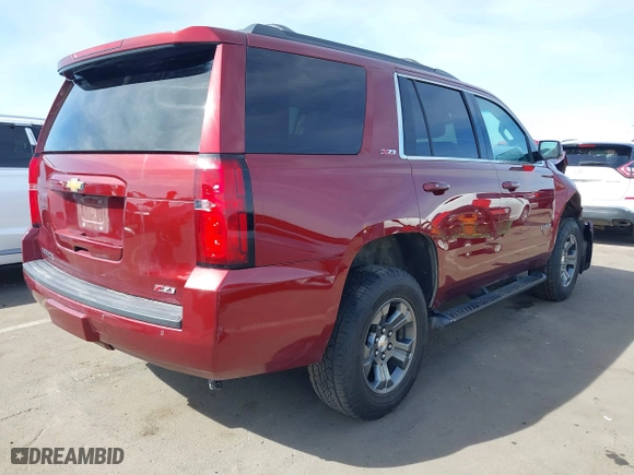 2018 Chevrolet Tahoe LT with VIN 1GNSKBKC0JR213007, listed as a IAAI auction lot 41613263 with 137,537 mi miles. Bid and sale history available at carsss.com. Image 4.
