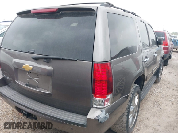2014 Chevrolet Tahoe LT with VIN 1GNSCBE08ER106419, listed as a IAAI auction lot 41789896 with 99,420 mi miles and . Bid and sale history available at DreamBid. Image 4.