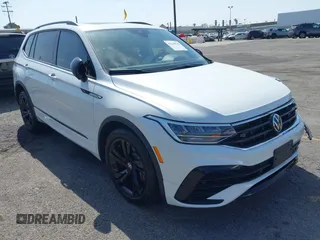 2024 Volkswagen Tiguan SE R-Line Black with VIN 3VVCB7AX7RM085619, listed as a IAAI auction lot 42325566 with 10,615 mi miles and . Bid and sale history available at DreamBid. Image 1.