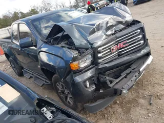 2015 GMC Canyon 2WD SLE with VIN 1GTH5BE36F1181725, listed as a IAAI auction lot 41106730 with 104,256 mi miles and . Bid and sale history available at DreamBid. Image 1.