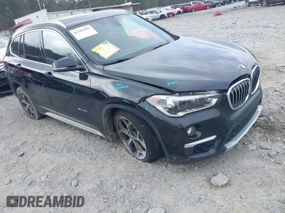 2017 BMW X1 sDrive28i with VIN WBXHU7C36HP924874, listed as a IAAI auction lot 41368396 with 113,443 mi miles. Bid and sale history available at carsss.com. Image 1.
