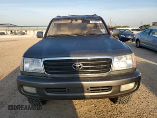 2000 Toyota Land Cruiser z VIN JT3HT05J9Y0123937, wystawiony jako Copart lot #56599145 z przebiegiem 132 262 mil mil oraz Szkoda całkowita • Salvage title. Historia ofert i sprzedaży dostępna na DreamBid. Obrazek 5.