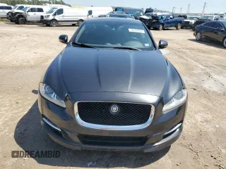 2013 Jaguar XJ with VIN SAJWA3HE9DMV49768, listed as a Copart auction lot 50339955 with 56,841 mi miles and Salvage Title. Bid and sale history available at DreamBid. Image 5.