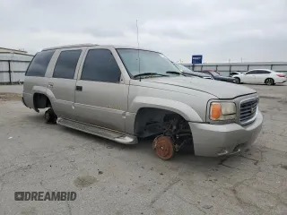 1999 Cadillac Escalade z VIN 1GYEK13R5XR415895, wystawiony jako Copart lot #87112044 z przebiegiem 141 662 mil mil oraz Tytuł czysty. Historia ofert i sprzedaży dostępna na DreamBid. Obrazek 4.