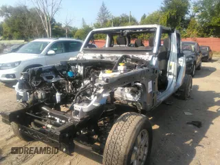 2022 Jeep Gladiator Willys with VIN 1C6HJTAG0NL131004, listed as a IAAI auction lot 40307060 with Not provided miles and . Bid and sale history available at DreamBid. Image 6.