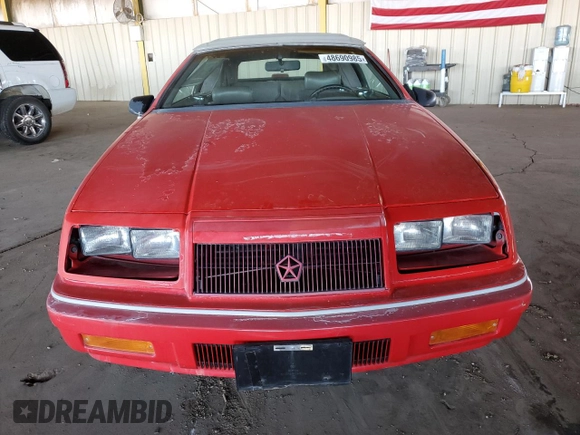 1990 Chrysler LeBaron z VIN 1C3XJ45J9LG405682, wystawiony jako Copart lot #48690985 z przebiegiem 75 714 mil mil oraz Tytuł czysty. Historia ofert i sprzedaży dostępna na DreamBid. Obrazek 5.