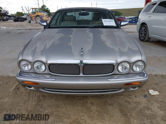 1999 Jaguar XJ with VIN SAJHX1043XC856474, listed as a IAAI auction lot 41626649 with 103,266 mi miles and . Bid and sale history available at DreamBid. Image 6.