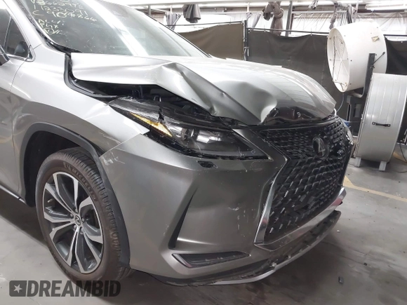 2022 Lexus RX 350 z VIN 2T2HZMDA9NC366292, wystawiony jako IAAI lot #42381449 z przebiegiem 26 717 mil mil oraz . Historia ofert i sprzedaży dostępna na DreamBid. Obrazek 6.
