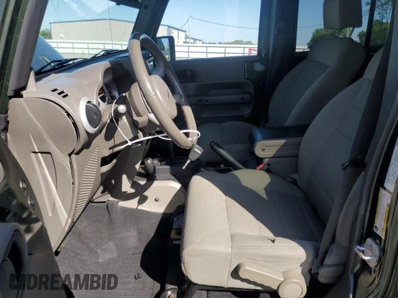 2008 Jeep Wrangler Unlimited Sahara with VIN 1J4GA59148L504608, listed as a Copart auction lot 52400325 with 123,959 mi miles and Salvage Title. Bid and sale history available at carsss.com. Image 7.
