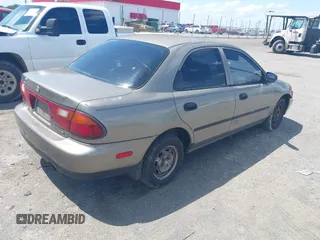1997 Mazda Protege DX with VIN JM1BC1416V0132633, listed as a IAAI auction lot 42162630 with 234,300 mi miles and . Bid and sale history available at DreamBid. Image 4.