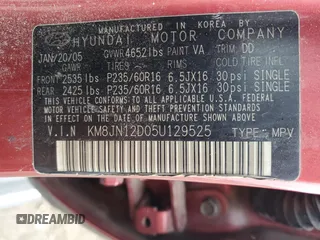 2005 Hyundai Tucson GLS with VIN KM8JN12D05U129525, listed as a Copart auction lot 79690934 with 169,061 mi miles and Salvage Title. Bid and sale history available at carsss.com. Image 13.