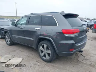 2014 Jeep Grand Cherokee Overland with VIN 1C4RJECG5EC207211, listed as a IAAI auction lot 41586309 with 115,293 mi miles. Bid and sale history available at carsss.com. Image 3.