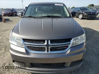 2013 Dodge Journey American Value with VIN 3C4PDCAB8DT590509, listed as a Copart auction lot 57347375 with 203,642 mi miles and Clean title. Bid and sale history available at DreamBid. Image 5.