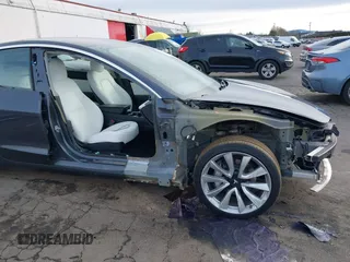 2018 Tesla Model 3 Long Range Battery with VIN 5YJ3E1EB9JF097118, listed as a IAAI auction lot 41619510 with 64,132 mi miles and . Bid and sale history available at DreamBid. Image 6.