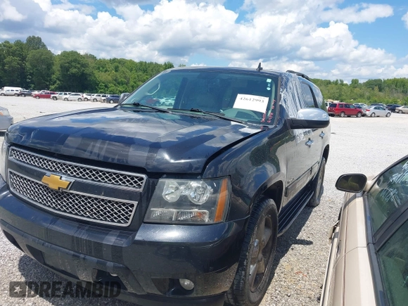 2012 Chevrolet Tahoe LT with VIN 1GNSCBE05CR211898, listed as a IAAI auction lot 42612993 with 233,367 mi miles and . Bid and sale history available at DreamBid. Image 2.