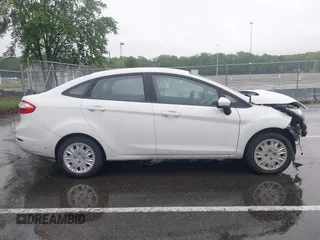 2016 Ford Fiesta S z VIN 3FADP4AJ1GM205836, wystawiony jako IAAI lot #42267013 z przebiegiem 96 778 mil mil oraz . Historia ofert i sprzedaży dostępna na DreamBid. Obrazek 13.