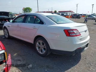 2014 Ford Taurus SEL with VIN 1FAHP2E84EG141795, listed as a IAAI auction lot 42133668 with 154,009 mi miles and . Bid and sale history available at DreamBid. Image 3.