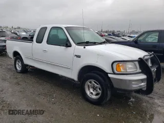 1997 Ford F-150 with VIN 2FTEX18L6VCA28603, listed as a Copart auction lot 49100835 with 127,510 mi miles and Salvage title. Bid and sale history available at DreamBid. Image 4.