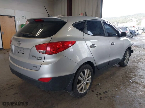 2011 Hyundai Tucson Limited with VIN KM8JUCAC2BU156616, listed as a IAAI auction lot 41788854 with 193,978 mi miles. Bid and sale history available at carsss.com. Image 4.