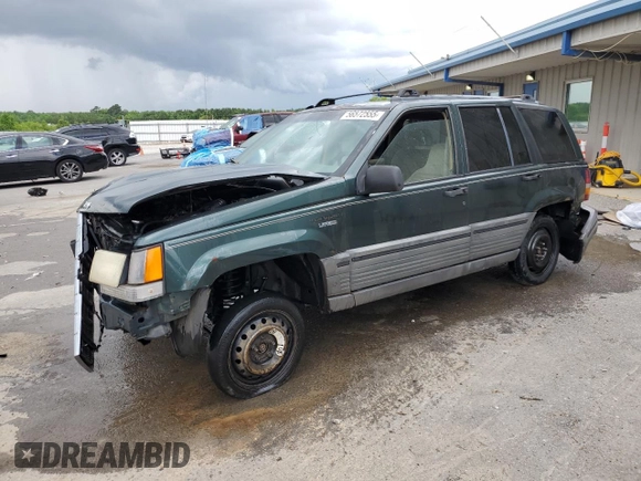 1995 Jeep Grand Cherokee Laredo with VIN 1J4FX58S8SC773884, listed as a Copart auction lot 56572555 with 424,126 mi miles and Salvage title. Bid and sale history available at DreamBid. Image 1.