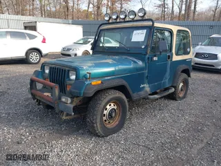 1995 Jeep Wrangler S with VIN 1J4FY19P5SP243137, listed as a IAAI auction lot 41787400 with 136,565 mi miles. Bid and sale history available at carsss.com. Image 2.
