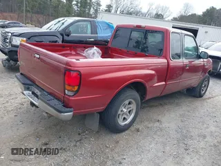 1999 Mazda B-Series 2WD Truck SE with VIN 4F4YR16X9XTM36395, listed as a IAAI auction lot 41398685 with 256,929 mi miles. Bid and sale history available at carsss.com. Image 4.