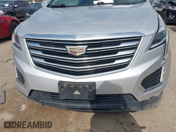 2019 Cadillac XT5 Premium Luxury AWD z VIN 1GYKNFRS0KZ207739, wystawiony jako IAAI lot #42229089 z przebiegiem 99 801 mil mil oraz . Historia ofert i sprzedaży dostępna na DreamBid. Obrazek 11.