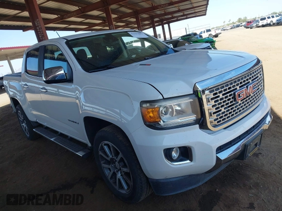 2018 GMC Canyon 4WD Denali z VIN 1GTP6EE11J1178961, wystawiony jako IAAI lot #42499884 z przebiegiem 71 309 mil mil oraz . Historia ofert i sprzedaży dostępna na DreamBid. Obrazek 1.