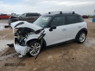 2014 MINI Countryman S with VIN WMWZC3C50EWP29415, listed as a Copart auction lot 55579045 with 102,151 mi miles and Salvage title. Bid and sale history available at DreamBid. Image 1.