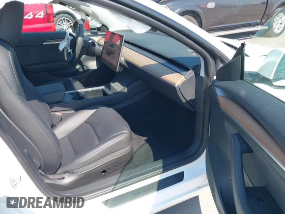 2023 Tesla Model 3 with VIN 5YJ3E1EA9PF585632, listed as a IAAI auction lot 40520993 with 7,775 mi miles and . Bid and sale history available at DreamBid. Image 5.