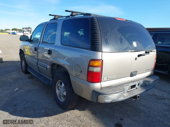 2003 Chevrolet Tahoe LS with VIN 1GNEC13V13J163837, listed as a IAAI auction lot 41641915 with 102,312 mi miles. Bid and sale history available at carsss.com. Image 3.