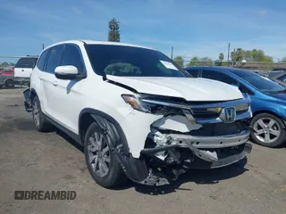 2020 Honda Pilot EX-L with VIN 5FNYF5H59LB027265, listed as a IAAI auction lot 41826300 with 57,201 mi miles. Bid and sale history available at carsss.com. Image 1.
