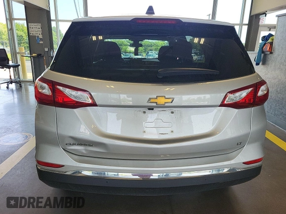 2020 Chevrolet Equinox LT with VIN 2GNAXJEV0L6236404, listed as a IAAI auction lot 42619695 with 77,124 mi miles and . Bid and sale history available at DreamBid. Image 13.